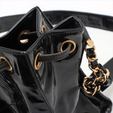 Sac seau vintage Chanel Coco en cuir vinyle noir
